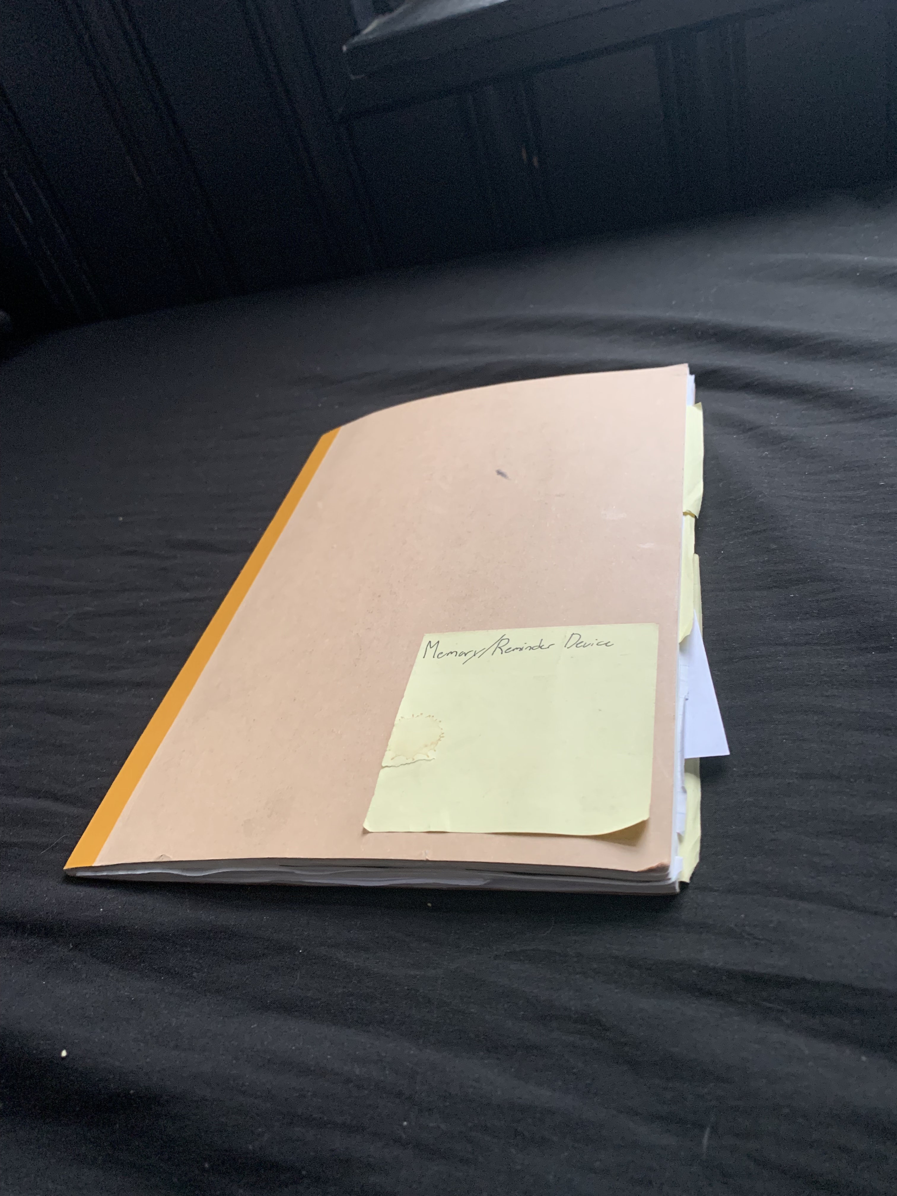 a photo of a notebook, it is the research journal for the remind app project